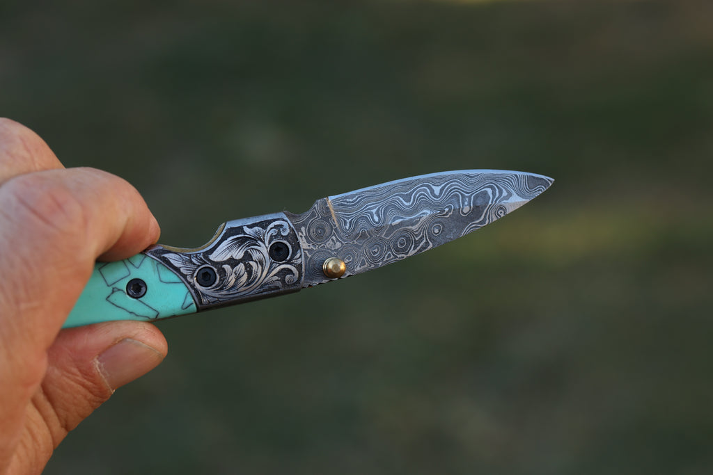 Turquoise Damascus Folding Knife – Hand Engraved Bolster