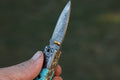 Turquoise Damascus Folding Knife – Hand Engraved Bolster