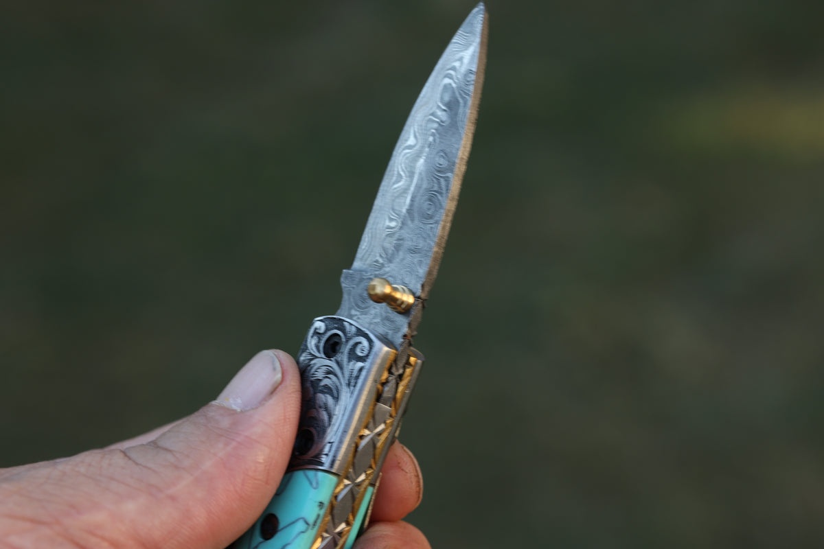 Turquoise Damascus Folding Knife – Hand Engraved Bolster