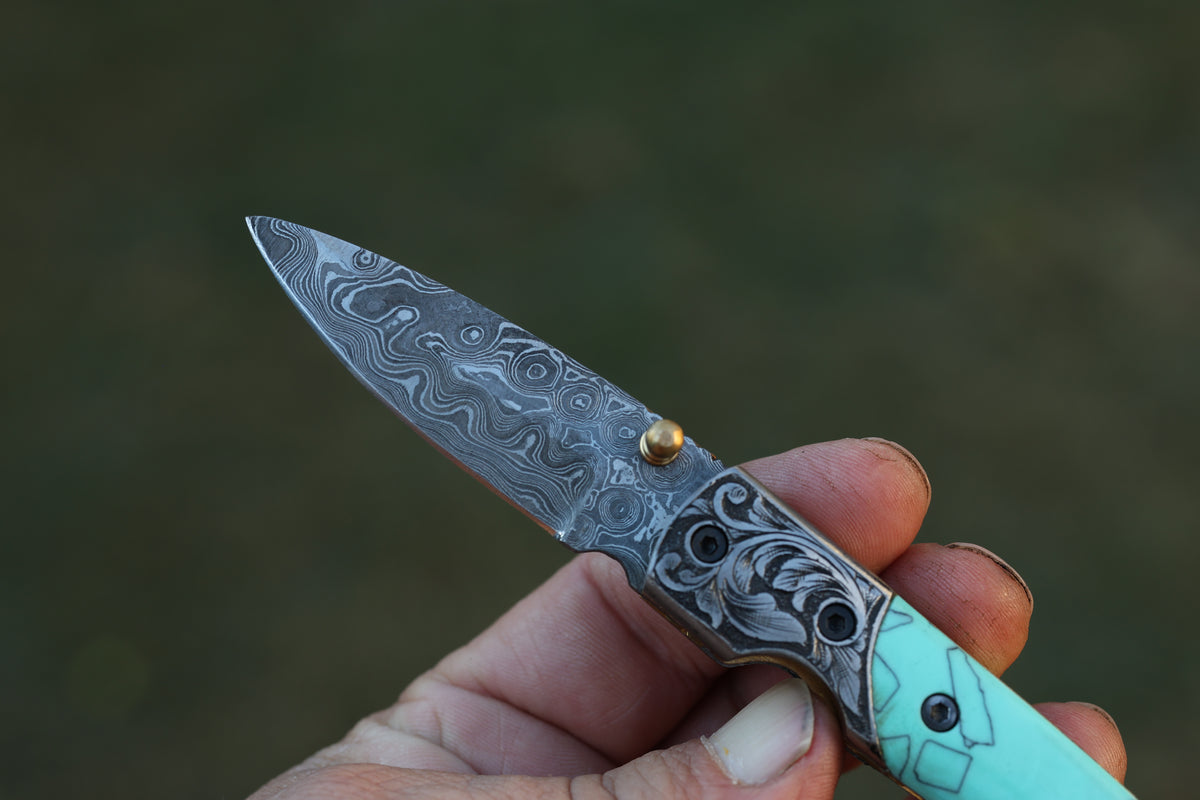 Turquoise Damascus Folding Knife – Hand Engraved Bolster