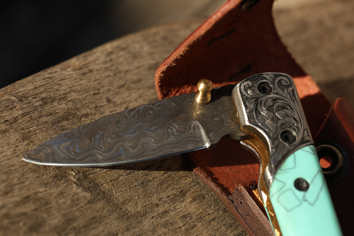 Turquoise Damascus Folding Knife – Hand Engraved Bolster